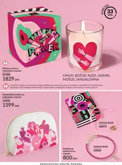 Kozmetička torbica sa ružičastom vrpcom, A white cosmetic bag with a gold zipper, featuring an illustration of several women in various poses, predominantly in pink and red hues. - pregled AVON kataloga - važi od 01.06.2026 | Strana: 199